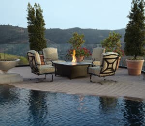 Outdoor chairs by pool and firepit from Hauser's Patio
