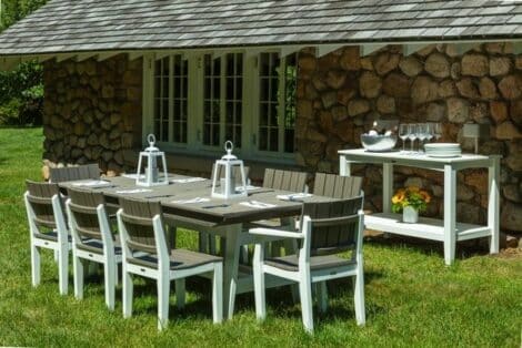 Wooden chairs and table from hausers patio by stone house luxury outdoor living by hausers patio