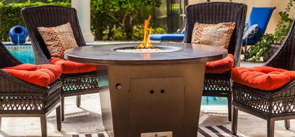 Firetainment round cooking fire pit table luxury outdoor living by hausers patio