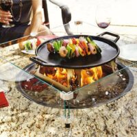dining outdoors cooking fire table