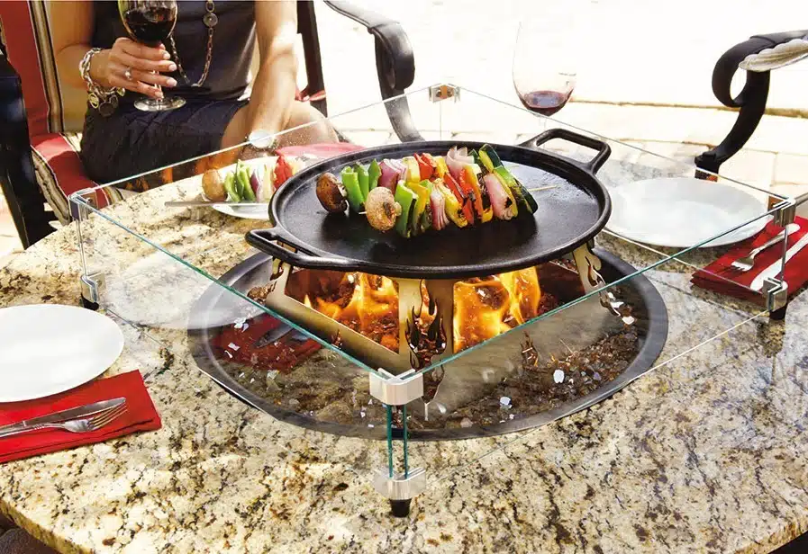 dining outdoors cooking fire table