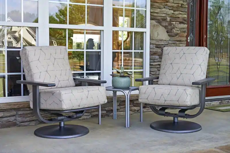 White swivel chairs with grey base from hausers patio luxury outdoor living by hausers patio