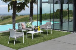Patio chairs and table by pool in San Diego, CA