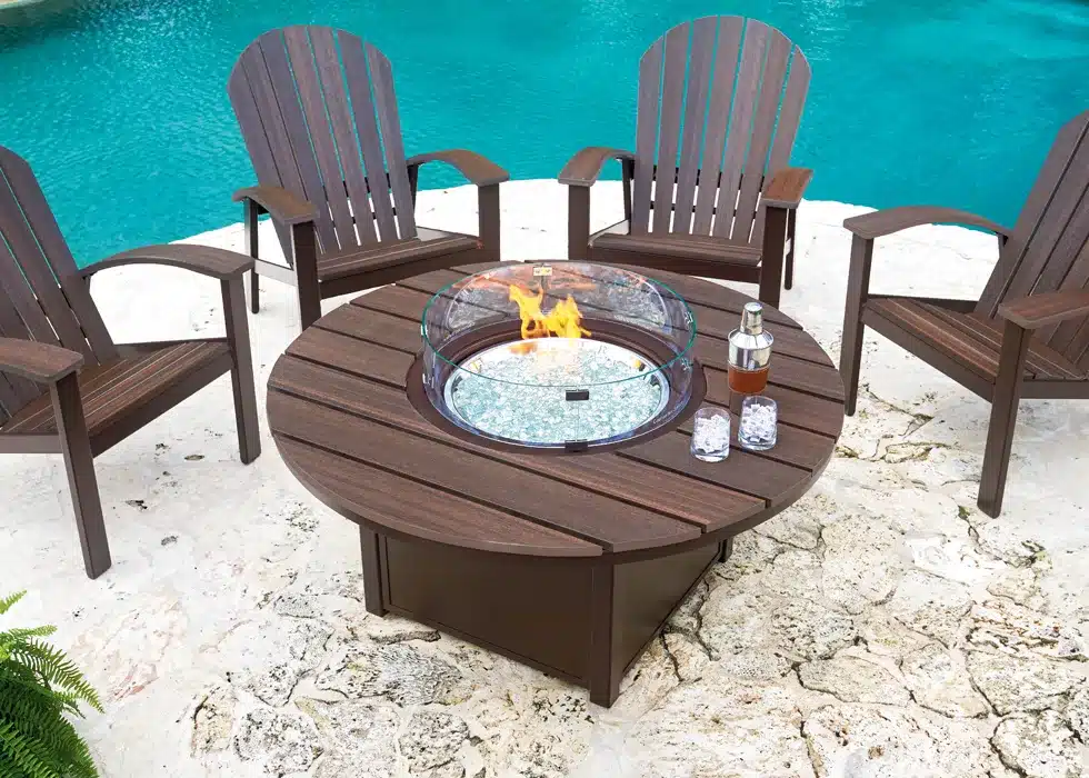 Wooden chairs around wooden fire pit from hausers patio luxury outdoor living by hausers patio
