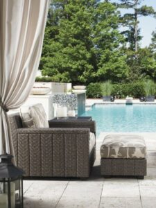 Outdoor cushion chair and ottoman by pool from Hauser's Patio

