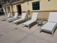 Row of lounge chairs with replacement slings from Hauser's Patio